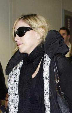 Madonna glams up a natural look with some MDG Collection sunglasses