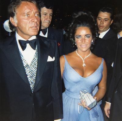 Elizabeth Taylor with Richard Burton, at the 42nd Academy Awards® on April 7, 1970 Elizabeth Taylor with Richard Burton, at the 42nd Academy Awards® on April 7, 1970