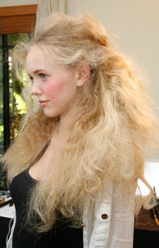 Hair is full and voluminous with an airy soft texture that allows for movement as you walk